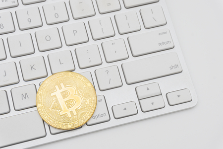 Golden Bitcoins on keyboard. Selective focus.の写真素材