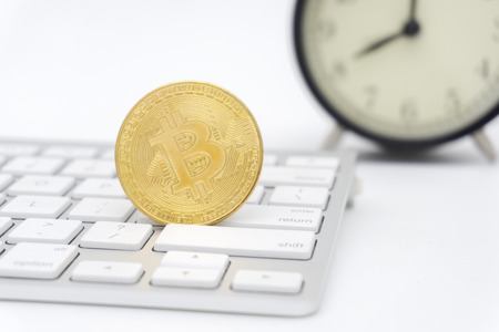 Golden Bitcoins on keyboard. Selective focus.の写真素材