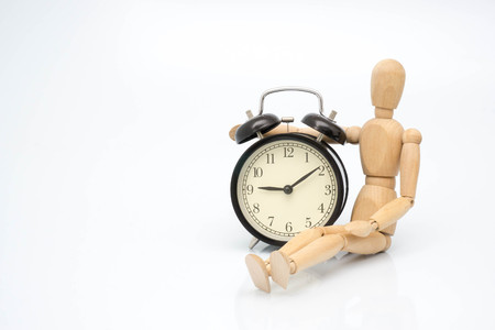 Concept clock bell with wooden robotの写真素材