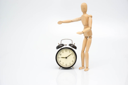 Concept clock bell with wooden robotの写真素材