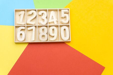 wooden numbers in the colorful background boxの写真素材