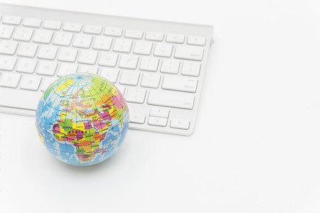 Earth and keyboard, global & international business conceptの写真素材
