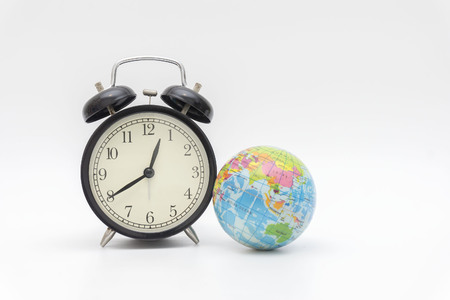 Earth and clock, the concept of world time nowの写真素材