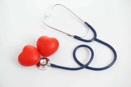stethoscope and red heart on a white backgroundの写真素材