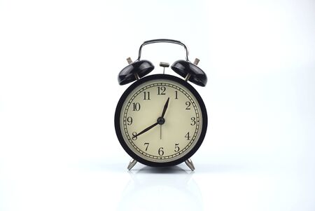 black bell clock with white backgroundの写真素材