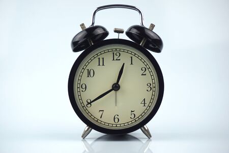 black bell clock with white backgroundの写真素材