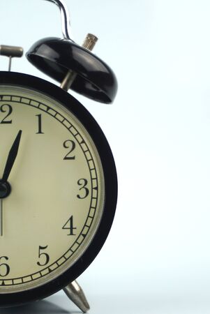 black bell clock with white backgroundの写真素材