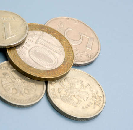 Coins on colored (blue) background. Close-up. Coins of Russian Federation bankの写真素材