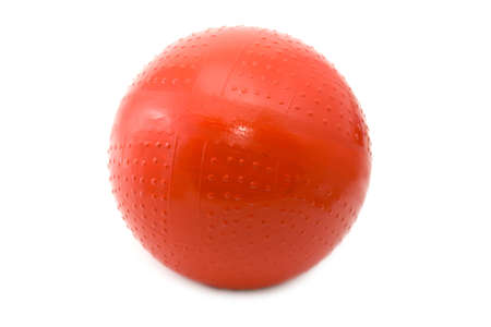 Red children's rubber ball on a white backgroundの写真素材