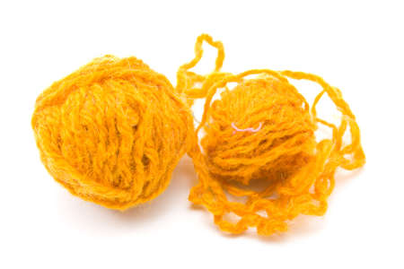 two red threads for knitting on a white backgroundの写真素材