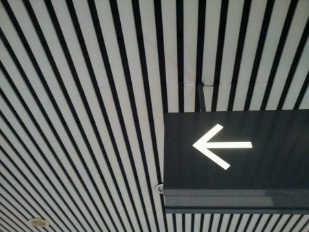 arrow sign at train station