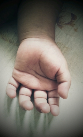 Hand of a baby while sleepingの素材