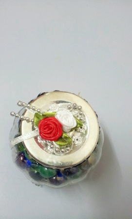 Marbles inside round container as a giftの素材