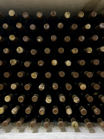 Moldovan winery: vintage bottle design. A lot of wine bottles in cellarの写真素材