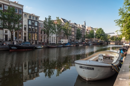 Anchored boats in one of the canals in Amsterdam, Netherlandsのeditorial素材