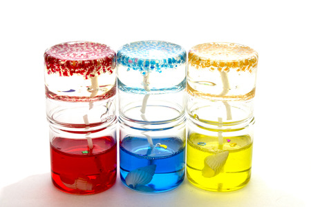 candles in glass on each other on a white backgroundの写真素材