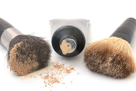 brush and cream isolated over whiteの写真素材