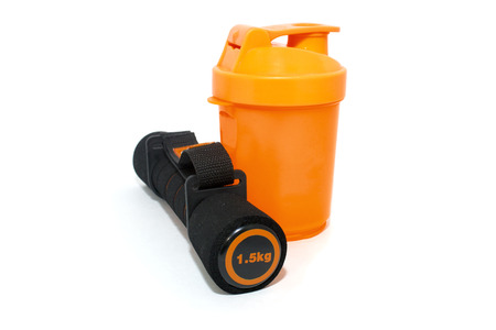 dumbbell and shaker isolated over whiteの写真素材