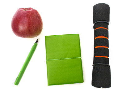 dumbbelll and notebook isolated over whiteの写真素材