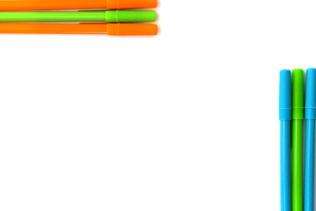background from multi-colored pens isolatd over whiteの写真素材