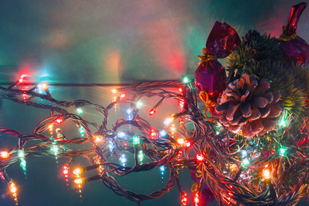Christmas-tree branch pine cone and garlandsの写真素材