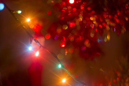 bokeh garland on a Christmas treeの写真素材