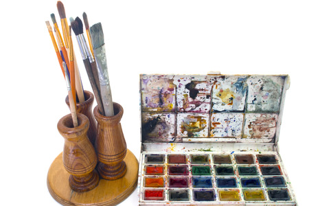 brush for painting and paint in a stand isolated on a white topの写真素材