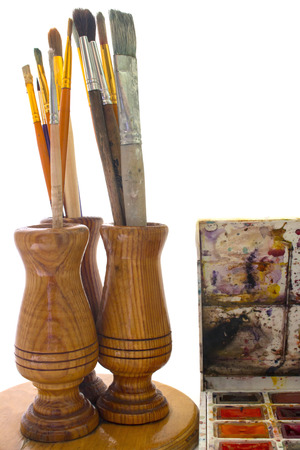 brush for painting and paint in the stand isolated on whiteの写真素材