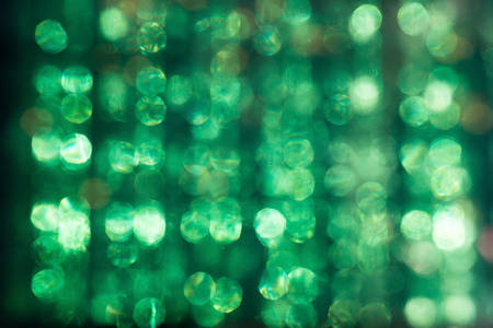 defocused glare of the sun through the Plexiglas abstract green backgroundの写真素材