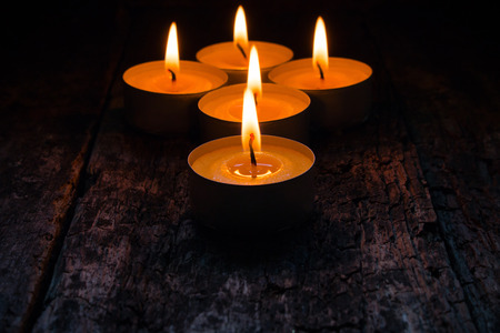 lighted candles to relax on the wooden backgroundの写真素材