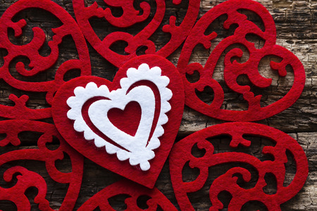 pattern of red hearts on a wooden backgroundの写真素材