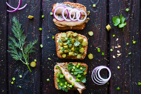 Sandwiches with fish on a background of of herbsの写真素材
