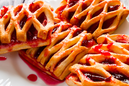 cookies with jam on a white plate closeupの写真素材