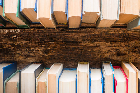 Vintage books and place for text on wooden backgroundの写真素材
