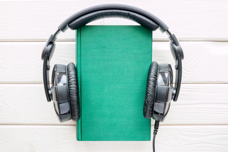 Headphones on the book in hardcoverの写真素材
