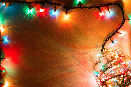 garland in a glass jar. Christmas lights mockupの写真素材