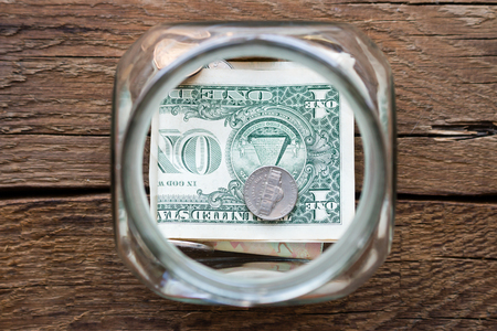 glass jar for donations closeupの写真素材