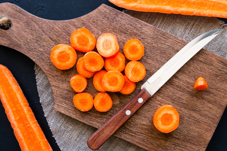 sliced carrots on a cutting boardの写真素材