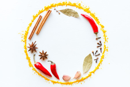 Spices and herbs in the form of a circle with space for text