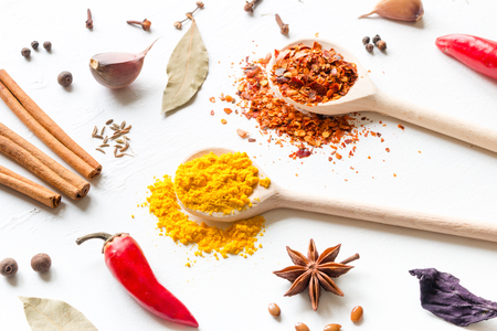 various seasonings and spices on a white backgroundの写真素材