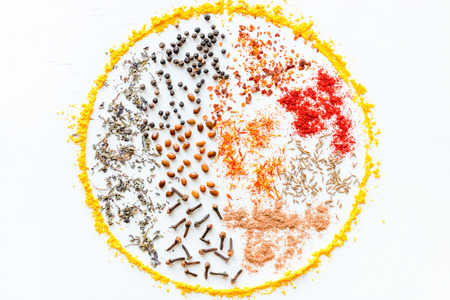 seasonings and spices for cooking in the shape of a circle on a white backgroundの写真素材
