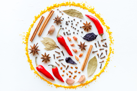 spices and herbs in the shape of a circle on a white backgroundの写真素材