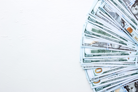 American dollars on a white background with space for text