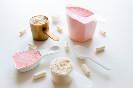 sport supplements - protein, gainer, creatine, bcaa on a white backgroundの写真素材