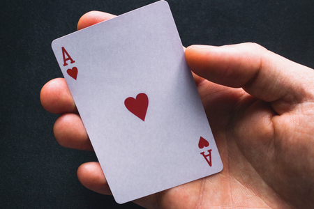 holding an ace card close upの写真素材
