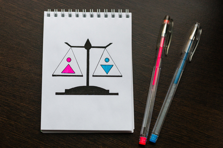 drawn scales with male and female sign. concept of gender equalityの写真素材