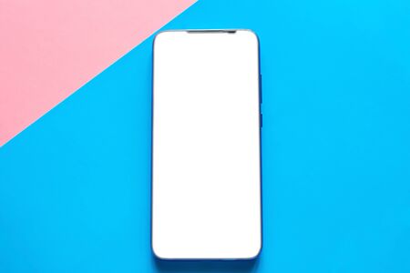 mobile phone on a colored background with a white blank screen. smartphone with place for text...