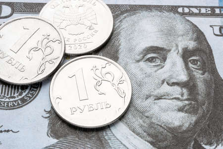 dollar bill and russian ruble close up devaluation of currency