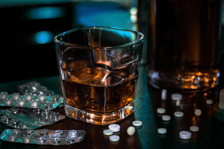 alcohol and pills addiction concept