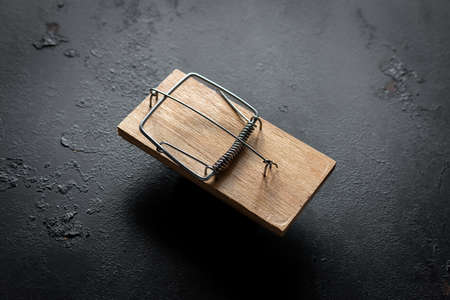 mousetrap on a black background concept for freeの写真素材